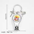 Detail of camping nail clipper keychain with caravan and road sign charms in silver metal - Beach Bones Beach Style (5)