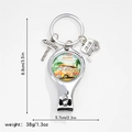 Detail of silver nail clipper with camping charms and vintage surf bus graphics - Beach Surf Bus Style (7)