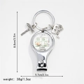 Detail showing camping themed nail clipper with camper van and road sign charms - Happy Camper Tent Style (9)