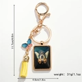 Detailed view of 11.7cm keychain with letter Q pendant, colorful butterfly and yellow tassel - Letter Q