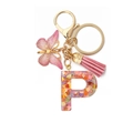 Detail of pink resin letter P keychain with heart sequins, butterfly charm and tassel - Letter P