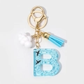 Detail of resin letter B keychain with blue sky clouds and gold lobster clasp - Letter B Style (B)