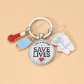 Detail of metal nurse keychain with thermometer, mask, and I Am A Nurse pendant charm - Medical Guardian Charms Combination (3)