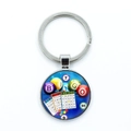 Detailed view of silver bingo keychain featuring colorful game balls and cards - Classic Bingo Game (5)