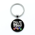 Detail view of round bingo keychain with colorful balls and funny text on black background - Funny Bingo Slogan (6)