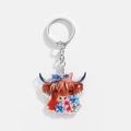 Detailed close-up of acrylic highland cow keychain with American flag bow and floral motifs - Flag Bow with Red Blue Flowers Style (12)
