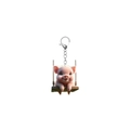 Detailaufnahme eines 2D Acryl-Schweins auf einer Schaukel mit silbernem Schlüsselring - Schwein auf Schaukel