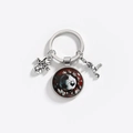 Detailed view of the soccer theme keychain with glass pendant and silver alloy charms - Football