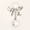 Silver medical themed keychain featuring syringe, stethoscope and floral letter G charm - Letter G / 9.5CM
