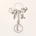 Detail of medical keychain with nurse hat, stethoscope, and floral letter L charm - Letter L / 9.5CM