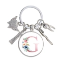 Porte-clés dentaire détaillé avec breloques argentées et pendentif lettre G fleurie - Motif Alphabet G (G)