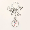 Close-up of nurse keychain with syringe stethoscope and floral letter P charms - Letter P / 9.5CM