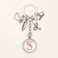 Detailed view of silver nurse keychain with medical charms and letter S floral pendant - Letter S / 9.5CM