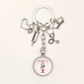 Nurse themed keychain with syringe and stethoscope charms featuring a floral letter T - Letter T / 9.5CM