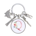 Vue détaillée d'un porte-clés de dentiste avec breloques dentaires et lettre Q rose - Motif Alphabet Q (Q)