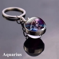 Macro shot of Aquarius constellation double-sided glass ball keychain with silver metal ring - Aquarius (12)