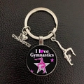 Close-up of gymnastics metal keychain with heart tag and athlete silhouette charm - Black Pink Starry (16)