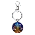 Macro detail of Libra zodiac sign keychain with celestial starry sky glass pendant - Libra