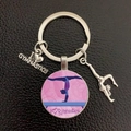 Close-up of silver metal gymnastics keychain with I love gymnastics charms on leather - Pink Floral (14)