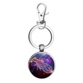 Detail of silver metal keychain featuring a celestial zodiac glass dome pendant - Fantasy Crustacean