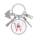 Détail du porte-clés dentaire avec breloques de dents et pendentif fleuri lettre W - Motif Alphabet W (W)