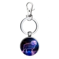 Detailed macro view of Aries constellation silver keychain with purple nebula glass dome charm - Aries