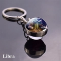 Libra zodiac keychain with double-sided glass ball and silver metal ring on black surface - Libra (2)