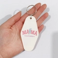 Close-up of white vintage motel keychain featuring pink MAMA and leopard print bolt graphics - Leopard Lightning MAMA