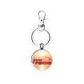 Detail of a silver alloy keychain with a sunset fishing scene and Gone Fishing text - Gone Fishing Sunset Style (3)