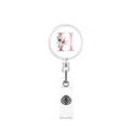 Macro detail of retractable badge holder with floral letter H on white background - Letter H