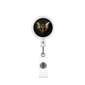 Detail of retractable badge holder with gold baroque letter T on black background - Letter T