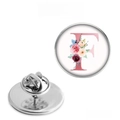 Detailed view of floral letter F badge with silver butterfly clutch pin backing - Letter F