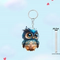 Detail view of the 0.25cm thickness of a 2D flat owl car ornament with metal keychain - Blue Orange Style(5)