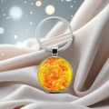 Zonnestelsel sleutelhanger met kristalglas op zijde met een zilveren metalen ring - Zon