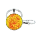 Close-up of silver solar system keychain featuring a detailed Saturn planet glass pendant - Sun