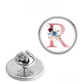 Detailed macro view of the silver metal lapel pin backing with a butterfly clutch closure - Letter R