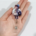 Retractable acrylic badge holder featuring a cute cartoon nurse character held in hand - Blue Uniform Backpack Nurse (4)