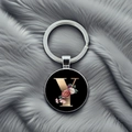 Macro shot of silver metal keychain with floral letter Y charm on grey plush background - Letter Y