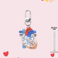 Macro side view showing the 0.25cm thickness of this acrylic heart anatomy keychain charm - Realistic Style Anatomical Heart (3)