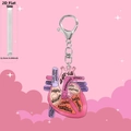 Detailed macro view showing the 0.25cm thickness of this acrylic heart anatomy keychain - Pink Anatomical Style B