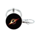 Macro detail of silver solar system keychain featuring a black hole astronomical pattern - Black Hole