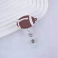 Detailed view of rugby-shaped retractable badge holder with realistic silicone texture - Rugby Style (14)