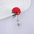 Detail of red football helmet retractable badge reel on white textured surface - Rugby Helmet (15)