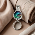 Polished metal nail clipper keychain with colorful northern lights glass dome decor - Deep Blue and Neon Green Gradient Aurora