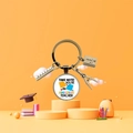 Detailed view of teacher appreciation keychain with ruler, notebook, and compass charms - Amazing Teacher Lettering Theme (5876366124523)