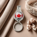 Detail of silver stainless steel nail clipper with Canadian flag maple leaf design - Style 18