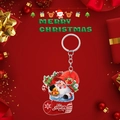 Detail of 2D acrylic Santa in red stocking keychain with gold bell and festive background - Santa in Christmas Stocking Style
