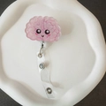 Close-up of cute acrylic brain badge reel with pink details for nurse and doctor ID cards - Cute Pink Brain Style (7)