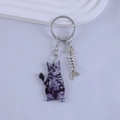 Detail of cartoon resin cat keychain with fish bone pendant and silver metal ring chain - Purple and Gray Striped Cat Style