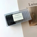 Nahaufnahme nahtloser elastischer Haargummis mit grauem Farbverlauf in einer Box - Grau (A-3303-5)